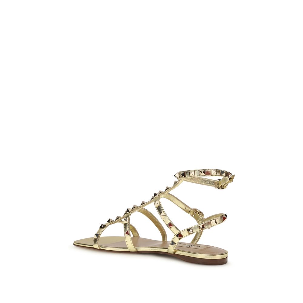Valentino Garavani Flache Sandalen aus Kalbsleder Bos Taurus in Gold