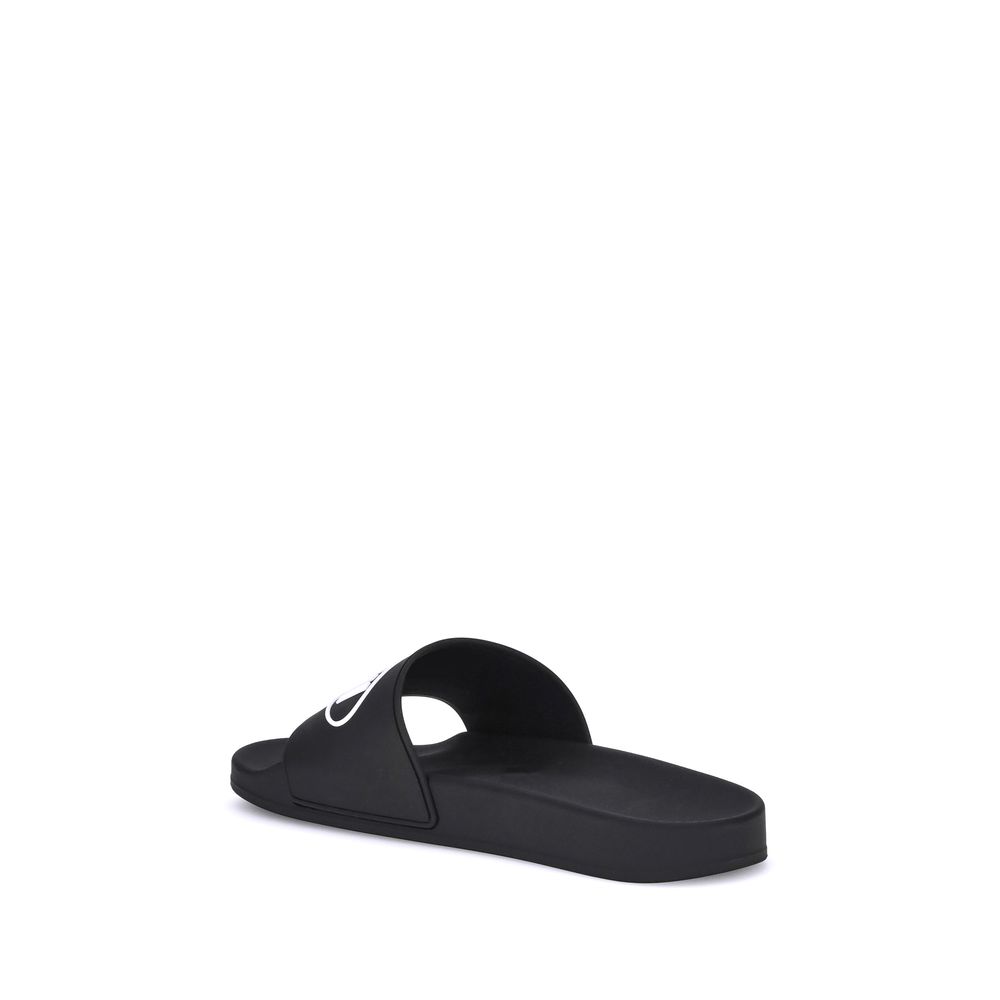 Sandales plates en caoutchouc noir Balenciaga
